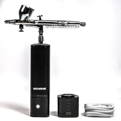 The new 2024 model barber airbrush cordless compressor package comes with a USB cable, battery pack, and precision nozzle for portable barber detailing.