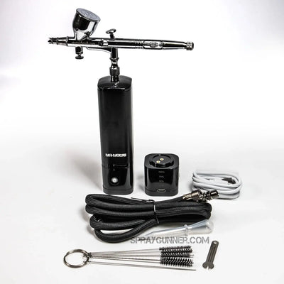 The new 2024 model barber airbrush cordless compressor set includes a precise nozzle, battery pack, and USB connector for portable barber detailing.